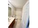 Bathroom featuring a tiled floor, a shower and bathtub combo, and a wooden vanity at 2749 Invermark St, Henderson, NV 89044