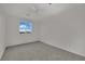 Simple bedroom design includes carpet and a ceiling fan with a single window at 2749 Invermark St, Henderson, NV 89044