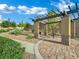 Inviting community area with a shaded pergola featuring stone pillars and a picnic table at 2749 Invermark St, Henderson, NV 89044