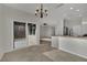 Open floor plan featuring dining area with sliding glass doors and breakfast bar at 2749 Invermark St, Henderson, NV 89044