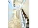 Foyer and staircase featuring neutral colors, tile flooring and natural light at 2749 Invermark St, Henderson, NV 89044
