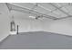 Spacious garage featuring a water heater and neutral finishes; ample room for parking and storage at 2749 Invermark St, Henderson, NV 89044