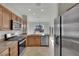Updated kitchen featuring stainless steel appliances, tile flooring, and bright natural light at 2749 Invermark St, Henderson, NV 89044