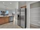 Updated kitchen with stainless steel refrigerator and pantry, filled with natural light at 2749 Invermark St, Henderson, NV 89044