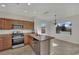 Kitchen view with stainless steel appliances, granite countertops, and breakfast bar at 2749 Invermark St, Henderson, NV 89044