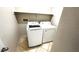 Laundry area with standard-sized washer and dryer and tiled floors at 2749 Invermark St, Henderson, NV 89044