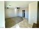 Open living room with a ceiling fan and mixed flooring at 2749 Invermark St, Henderson, NV 89044