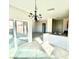 Living area featuring tile flooring, large windows, and an open layout at 2749 Invermark St, Henderson, NV 89044