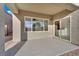 Covered patio with large windows, tile floors, and access to home's interior at 2749 Invermark St, Henderson, NV 89044