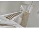 Staircase features neutral tile landing, with decorative light fixture at 2749 Invermark St, Henderson, NV 89044