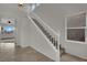Elegant staircase featuring tile floors on the landing and carpeted steps at 2749 Invermark St, Henderson, NV 89044