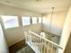 Staircase with natural light streaming through several windows above the railing at 2749 Invermark St, Henderson, NV 89044