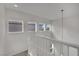 Bright staircase with white railing and natural light from multiple windows at 2749 Invermark St, Henderson, NV 89044