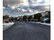 Neighborhood street view featuring mature trees, single-Gathering homes, and well-maintained landscaping at 2749 Invermark St, Henderson, NV 89044