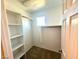 Walk-in closet featuring built-in shelving and ample storage space at 2749 Invermark St, Henderson, NV 89044