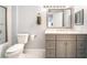 Bathroom with granite countertop, white toilet and shower at 3066 Tarpon Dr # 204, Las Vegas, NV 89120