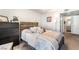 Bedroom with comfortable bed, dresser and doorway to bath at 3066 Tarpon Dr # 204, Las Vegas, NV 89120