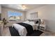 Comfortable bedroom features a large window offering serene views and a ceiling fan at 3066 Tarpon Dr # 204, Las Vegas, NV 89120