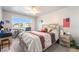 Cozy bedroom with large window offering neighborhood views at 3066 Tarpon Dr # 204, Las Vegas, NV 89120