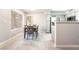 Cozy dining area with modern table and chairs, complemented by large windows and sleek tile floors at 3066 Tarpon Dr # 204, Las Vegas, NV 89120