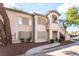 Charming condo featuring a two-story design with a staircase leading to the upper level entrance at 3066 Tarpon Dr # 204, Las Vegas, NV 89120