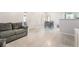 Inviting living room featuring tile flooring and a comfortable gray couch at 3066 Tarpon Dr # 204, Las Vegas, NV 89120