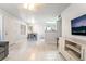 Bright, open-concept living area that includes updated tile floors, a dining area, and living room space at 3066 Tarpon Dr # 204, Las Vegas, NV 89120