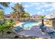 Inviting community pool with lounge chairs and tables, perfect for relaxation and socializing at 3066 Tarpon Dr # 204, Las Vegas, NV 89120