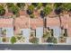 Aerial view of homes showcasing tile roofing, landscaping, and neighborhood layout at 3128 Faiss Dr, Las Vegas, NV 89134