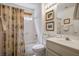 Bright bathroom with a shower and tub combination, a large mirror, and a modern vanity at 3128 Faiss Dr, Las Vegas, NV 89134