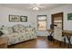Cozy bedroom with a daybed, desk, and natural light from the windows at 3128 Faiss Dr, Las Vegas, NV 89134