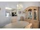 Dining room with wooden china cabinet, and an open view to the kitchen at 3128 Faiss Dr, Las Vegas, NV 89134