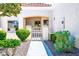 Charming home featuring a manicured front yard with lush green bushes and a tiled roof at 3128 Faiss Dr, Las Vegas, NV 89134