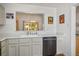 Bright kitchen features stainless steel appliances, white countertops, and a window that opens to the living room at 3128 Faiss Dr, Las Vegas, NV 89134