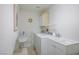 Convenient laundry room with a washer, dryer, sink, and storage, perfect for all your laundry needs at 3128 Faiss Dr, Las Vegas, NV 89134