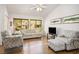 Bright living room with vaulted ceilings, comfortable seating, and large windows at 3128 Faiss Dr, Las Vegas, NV 89134