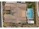 An aerial perspective of a house with a private pool, manicured landscaping, and a well-maintained roof at 3131 Reverence Heights Ln, Las Vegas, NV 89138