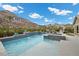 Breathtaking swimming pool and water feature, accented by patio and verdant landscaping at 3131 Reverence Heights Ln, Las Vegas, NV 89138