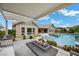 Beautiful backyard showcasing a pool, covered patio, fire pit, and outdoor kitchen for premier outdoor living at 3131 Reverence Heights Ln, Las Vegas, NV 89138