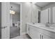 Elegant bathroom featuring double sinks with marble countertops, and access to the Bedroom at 3131 Reverence Heights Ln, Las Vegas, NV 89138