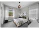 Serene bedroom featuring minimalist design, ample natural light, and a desk area at 3131 Reverence Heights Ln, Las Vegas, NV 89138