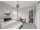 Inviting bedroom showcasing a comfortable bed, a desk area and view to the home's interior at 3131 Reverence Heights Ln, Las Vegas, NV 89138