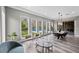 Dining room with large windows showcasing pool and landscaped backyard at 3131 Reverence Heights Ln, Las Vegas, NV 89138
