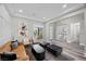 Stylish living room features natural lighting, wood floors, and modern decor at 3131 Reverence Heights Ln, Las Vegas, NV 89138