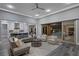Bright, open-concept living room with comfortable seating and seamless indoor/outdoor flow at 3131 Reverence Heights Ln, Las Vegas, NV 89138