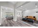 Spacious living room featuring an open floor plan, wood floors, and modern decor at 3131 Reverence Heights Ln, Las Vegas, NV 89138