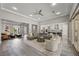 Spacious living room featuring modern decor, an open floor plan, and lots of natural light at 3131 Reverence Heights Ln, Las Vegas, NV 89138