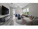 Open living room features a large sectional, decorative lighting, and ample seating at 3131 Reverence Heights Ln, Las Vegas, NV 89138