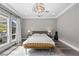 Bright main bedroom with large windows at 3131 Reverence Heights Ln, Las Vegas, NV 89138