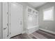 Bright mud room featuring storage bench, coat hooks, and plenty of natural light at 3131 Reverence Heights Ln, Las Vegas, NV 89138